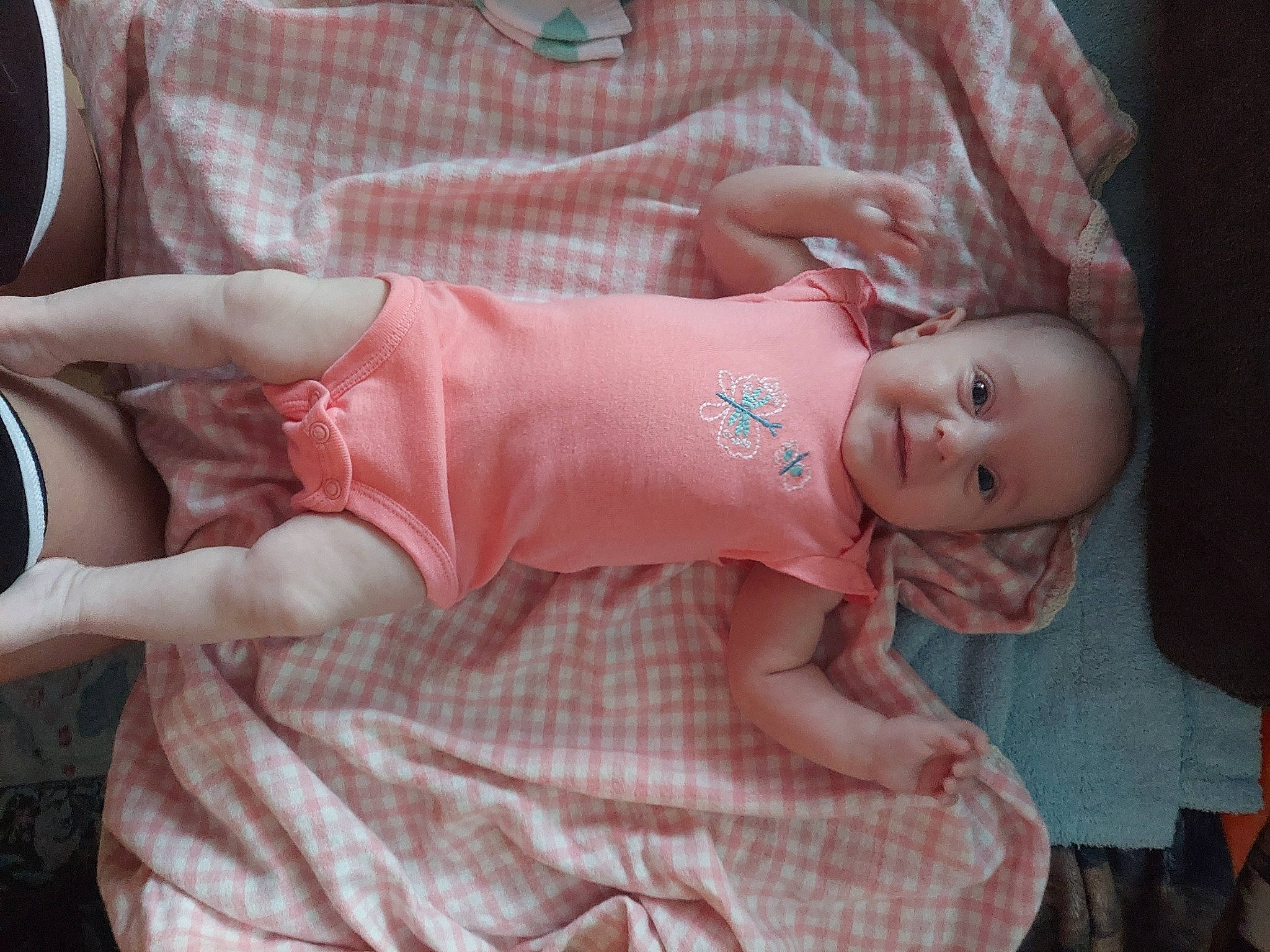 Demitria is registered to the contest to win money with this photo: baby, baby_toddler_clothing, cheek, child, comfort, dress, eye, facial_expression, finger, hand, human_body, joint, leg, mouth, person, pink, skin, sleeve, textile, toddler