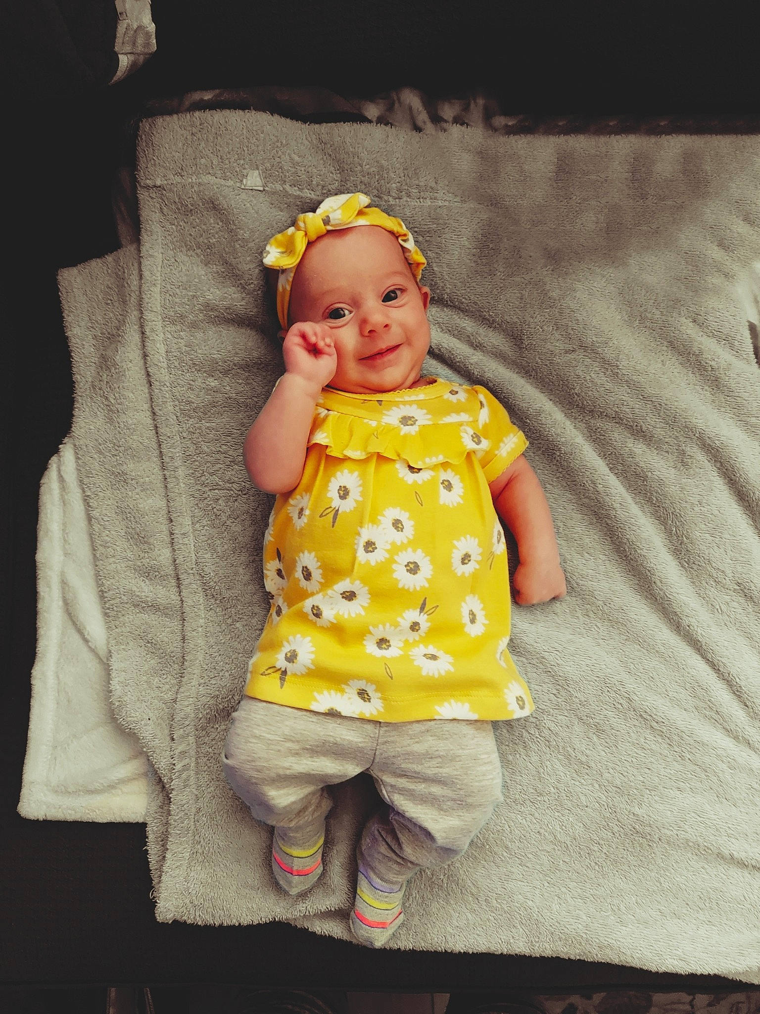 Demitria is registered to the contest to win money with this photo: baby, baby_products, baby_toddler_clothing, child, design, eye, face, fun, happy, joy, linens, outerwear, pattern, person, pink, product, skin, sleeve, smile, t_shirt