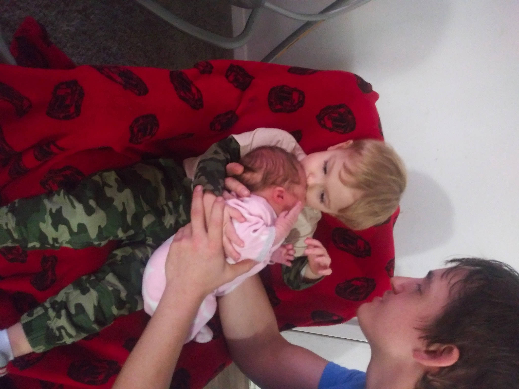 Ayden is registered to the contest to win money with this photo: baby, baby_toddler_clothing, carmine, child, comfort, event, finger, fun, gesture, happy, lap, linens, mouth, pattern, person, pink, red, skin, sleeve, t_shirt