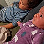 Rihannon is registered to the contest to win money with this photo: child, baby, infant, onesie, purple_clothing, blue_clothing, couch, indoor, relaxing, family, holding_hands, closeup, portrait, cute, young, sleepy, soft_fabric, home_interior, sibling, casual