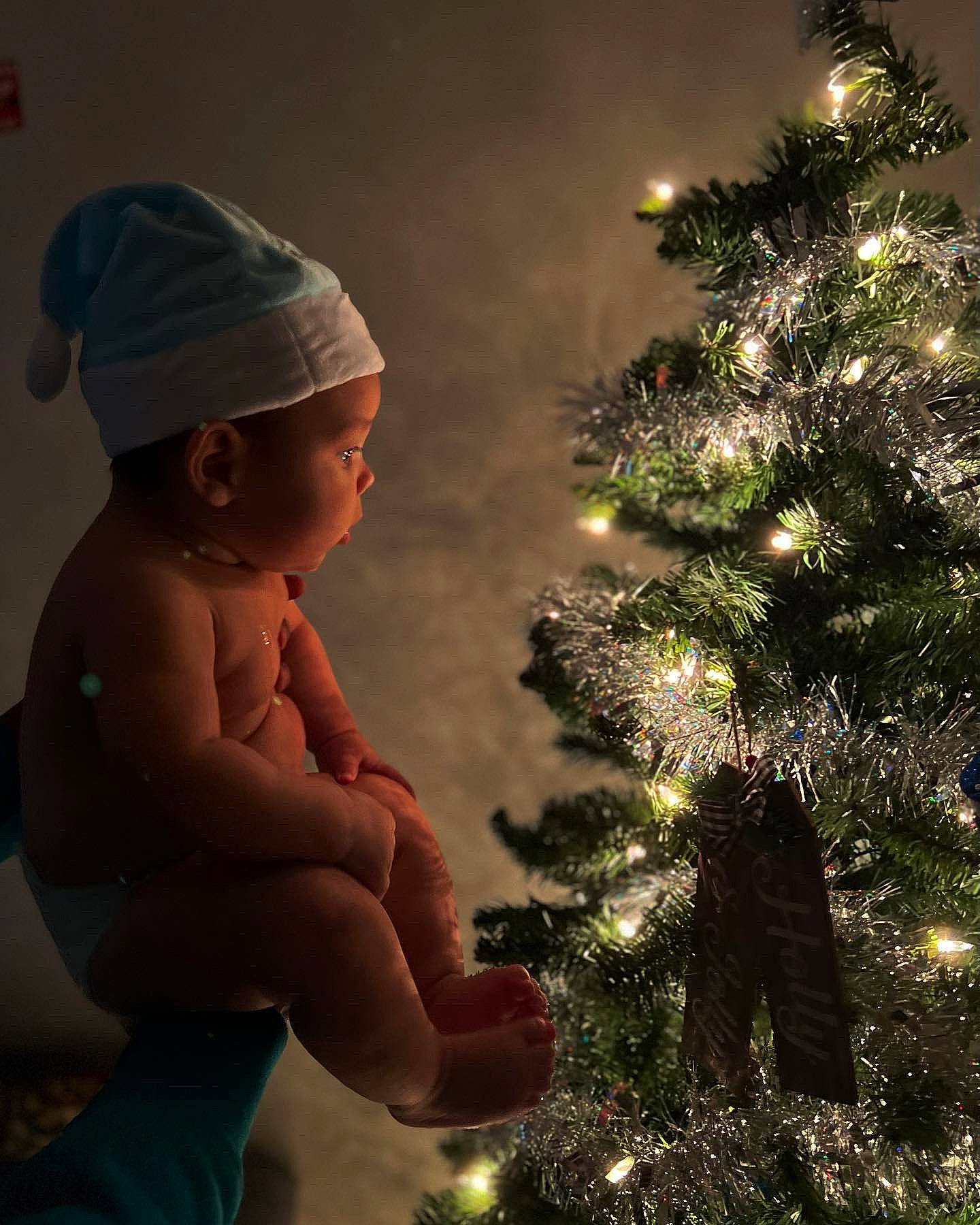 Reese joined the competition — help win amazing prizes! baby, baseball_cap, cap, christmas, christmas_decoration, christmas_ornament, christmas_tree, conifer, event, evergreen, grass, happy, holiday, holiday_ornament, larch, ornament, people_in_nature, person, sky, toddler