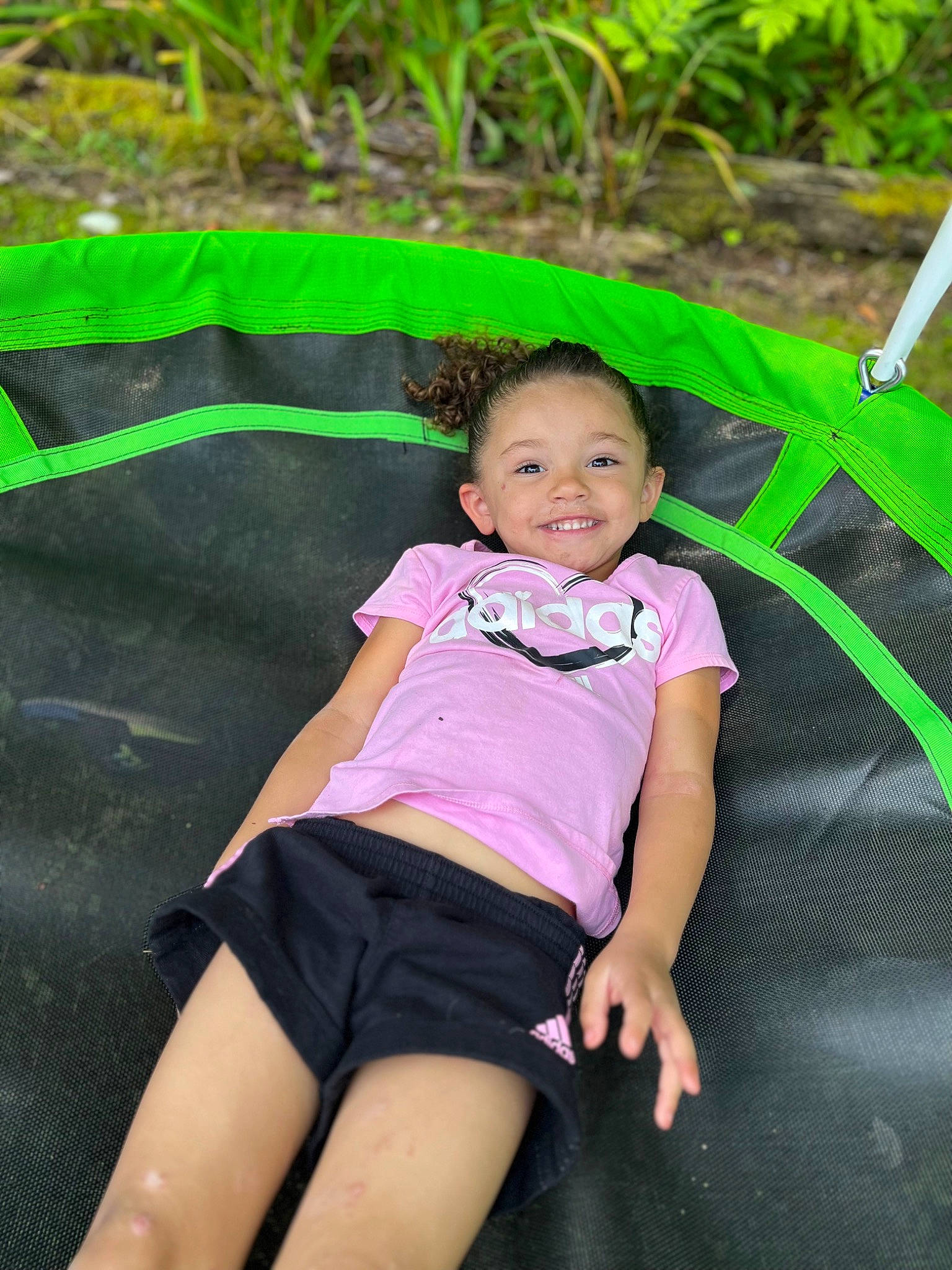 Ariella is registered to the contest to win money with this photo: baby_toddler_clothing, beauty, chair, child, eye, fun, grass, happy, human_leg, joy, leisure, people_in_nature, person, plant, recreation, shorts, sitting, skin, smile, t_shirt