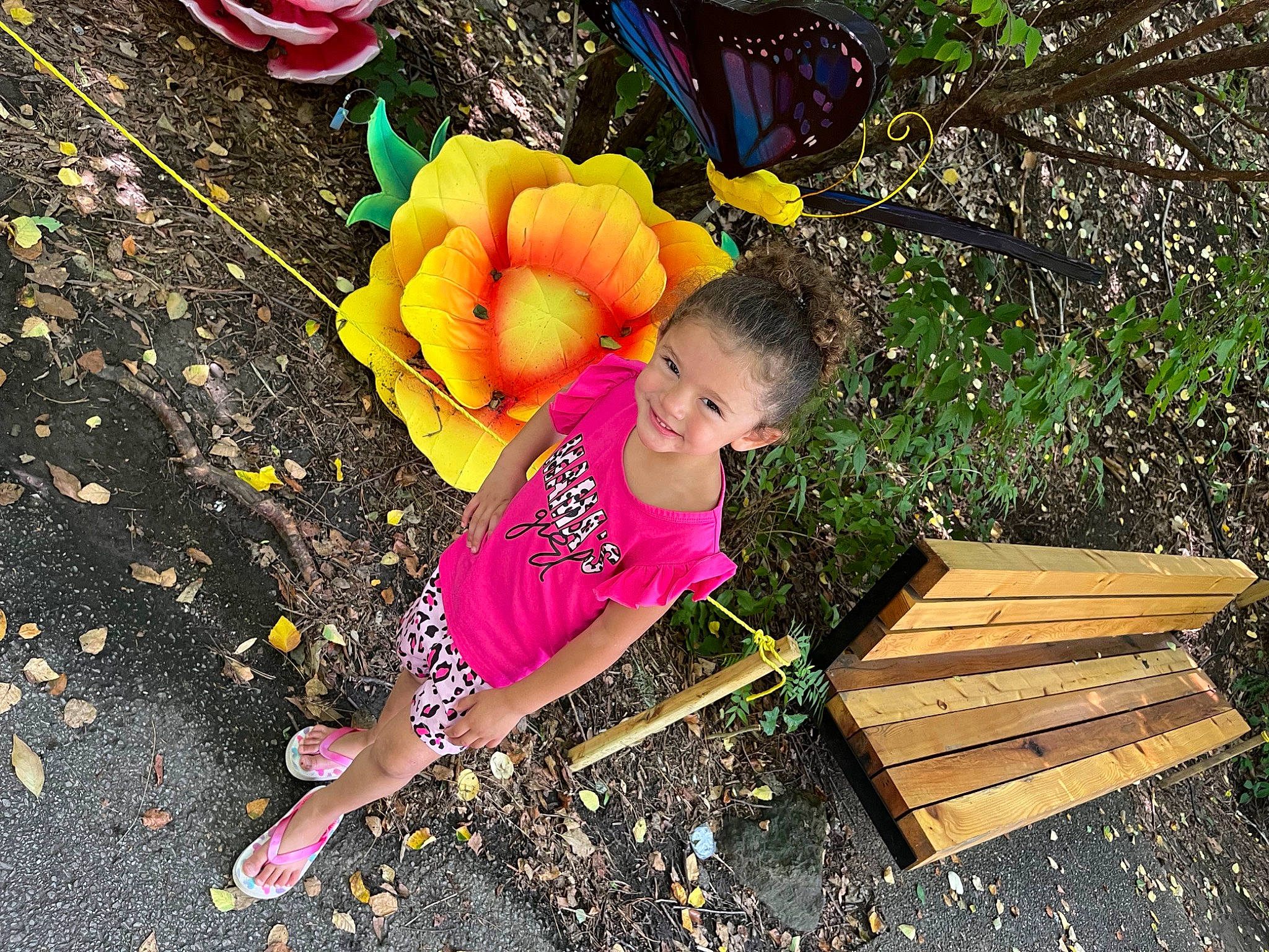 Ariella is registered to the contest to win money with this photo: asphalt, balloon, child, city, event, fun, grass, happy, hat, joy, leisure, magenta, people_in_nature, person, plant, play, road_surface, soil, spring, t_shirt