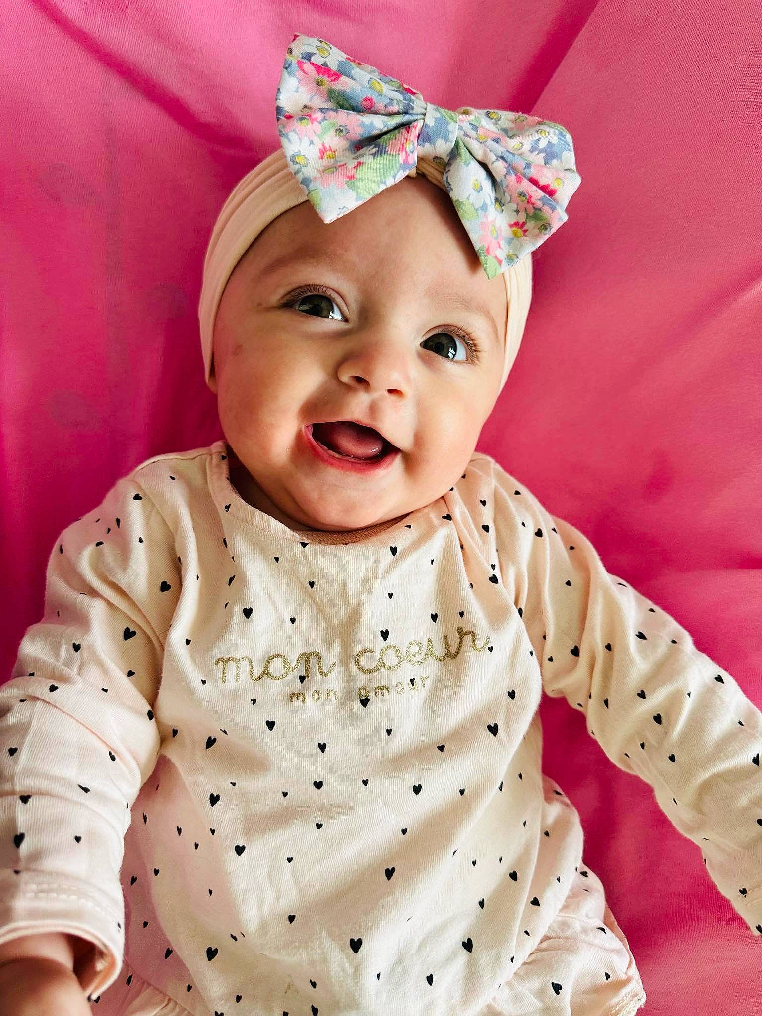 Elena participe au concours pour gagner de l'argent avec cette photo : baby, baby_toddler_clothing, child, collar, costume_hat, dress_shirt, fashion_accessory, hair_accessory, happy, headband, headpiece, headwear, magenta, party_supply, pattern, peach, person, pink, skin, sleeve