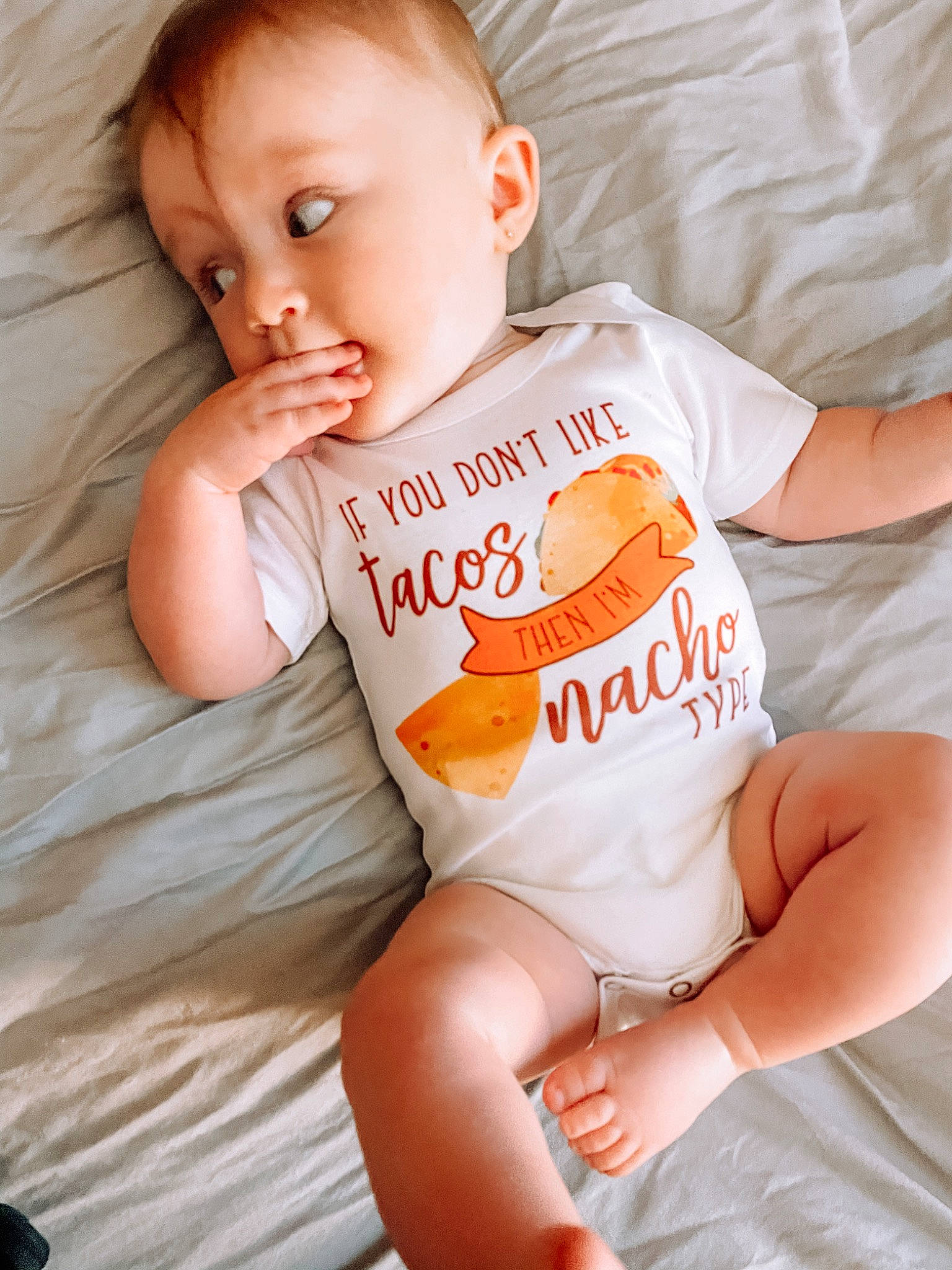 Bria is registered to the contest to win money with this photo: abdomen, baby, baby_sleeping, baby_toddler_clothing, cheek, chest, comfort, eye, head, human_body, joint, neck, orange, person, skin, sleeve, stomach, textile, thigh, toddler