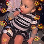 Jaylynn joined the competition — help win amazing prizes! toddler, child, lollipop, stroller, striped_clothing, black_and_white, curly_hair, indoors, halloween, pumpkin_stickers, sparkles, cute, baby, sitting, playful, festive, costume, holiday, fun, portrait