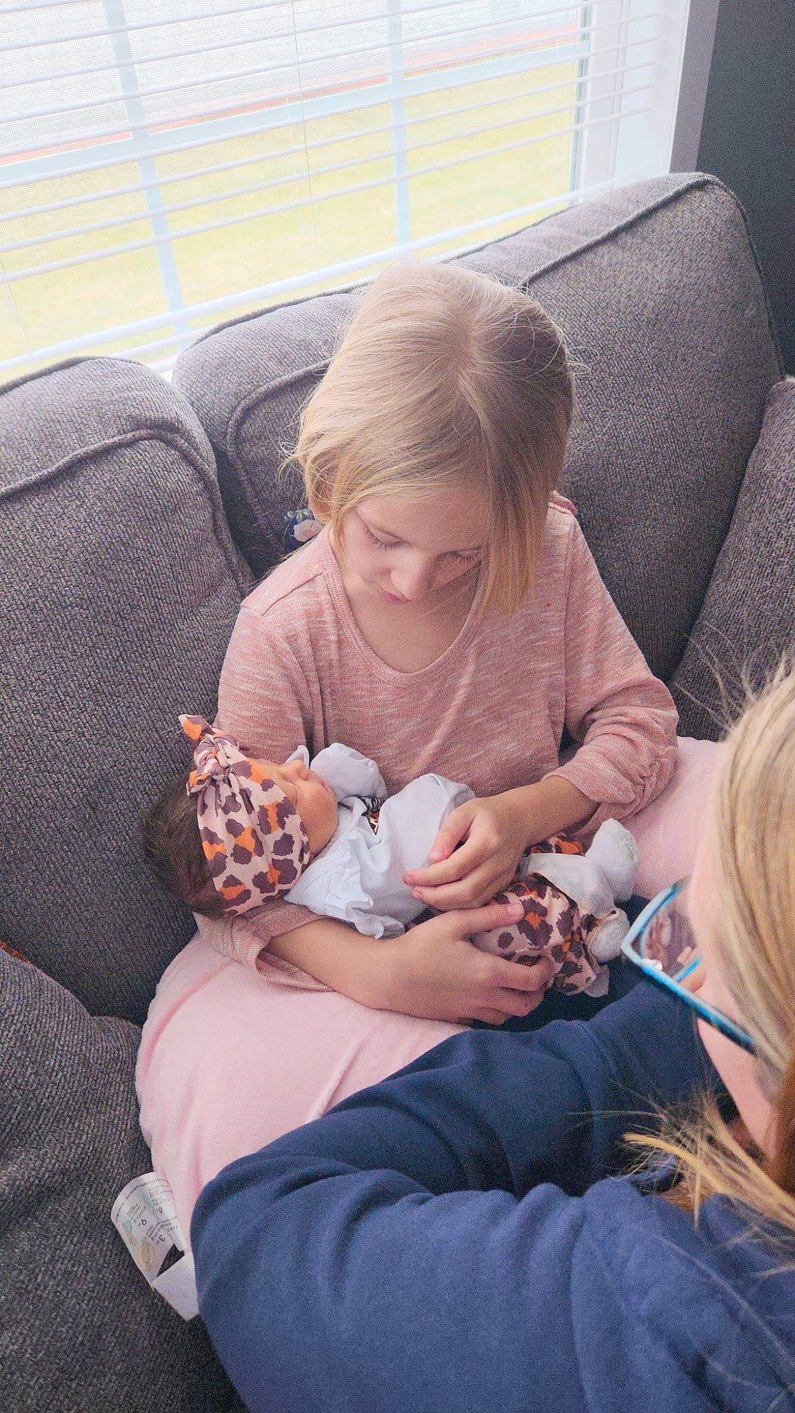 Alesia is registered to the contest to win money with this photo: baby, child, comfort, couch, event, eyewear, finger, hand, human_leg, knee, lap, leg, person, product, room, sitting, skin, thigh, toddler, vacation