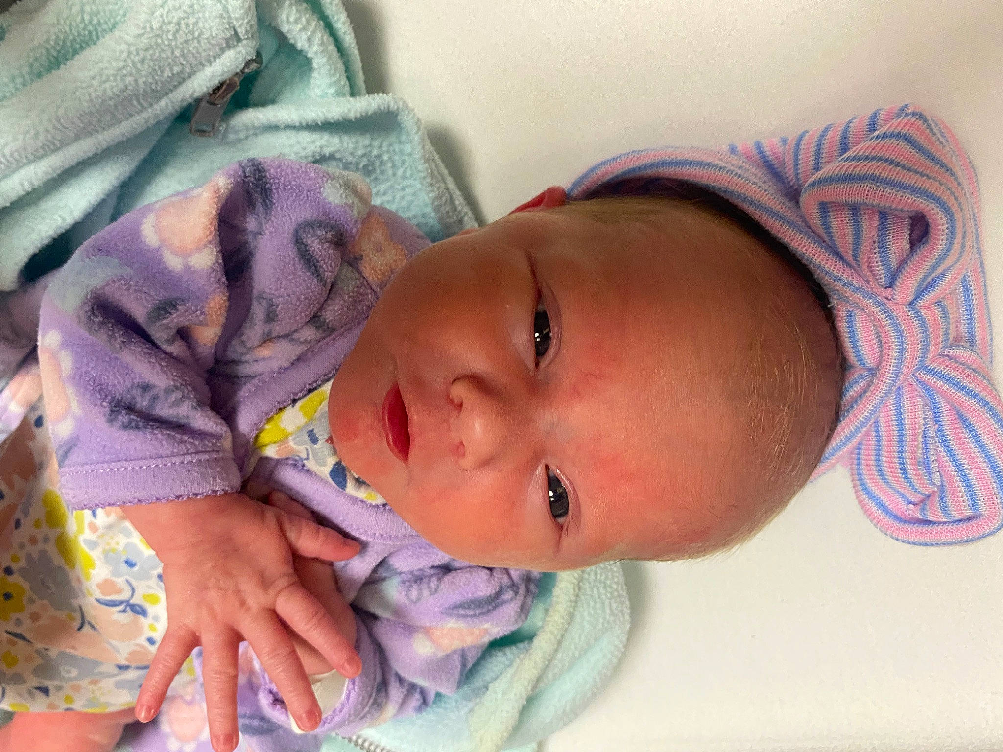 Kenzie is registered to the contest to win money with this photo: baby, baby_toddler_clothing, beauty, cheek, child, comfort, eyelash, face, hand, iris, lip, mouth, nose, organ, person, pink, purple, skin, sleeve, textile