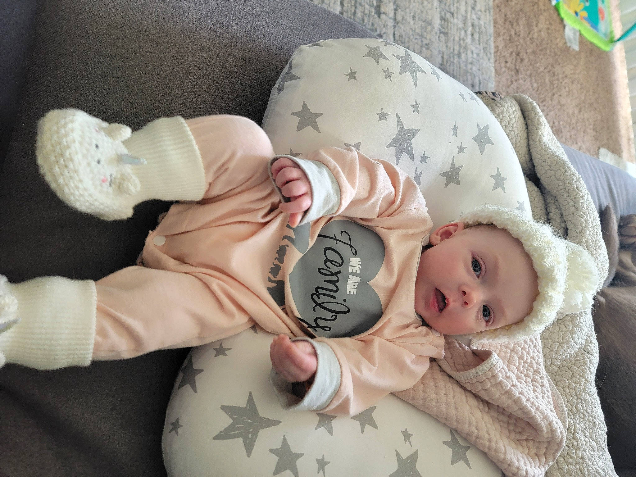 Haislee is registered to the contest to win money with this photo: arm, baby, baby_products, baby_safety, baby_sleeping, baby_toddler_clothing, cheek, child, comfort, eye, face, head, headgear, human_body, linens, person, skin, sleeve, stuffed_toy, surprise
