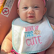 Willow joined the competition — help win amazing prizes! adorable, baby, bib, blue_eyes, car_seat, child, closeup, clothing, cute, face, hand, headband, infant, pacifier, pink_flower, safety, seatbelt, sitting, smiling, sunlight