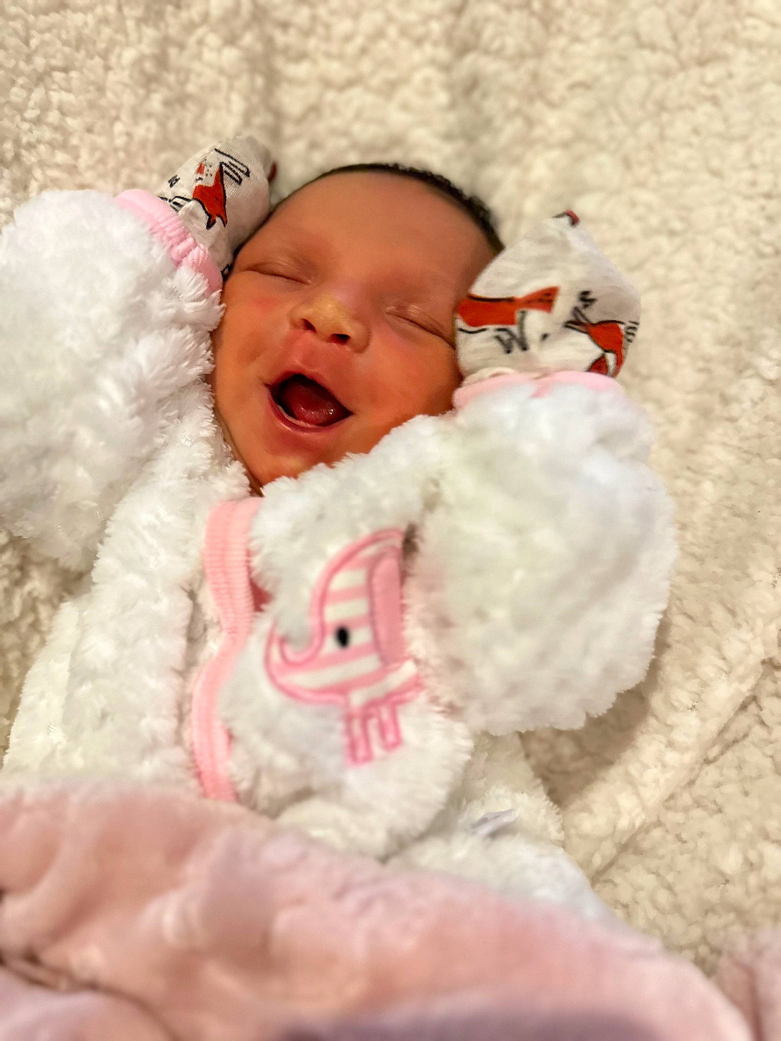 Winter joined the competition — help win amazing prizes! baby, baby_products, baby_sleeping, baby_toddler_clothing, bedding, cheek, comfort, fur, happy, head, headgear, linens, person, pink, room, skin, sleeve, smile, toddler, winter