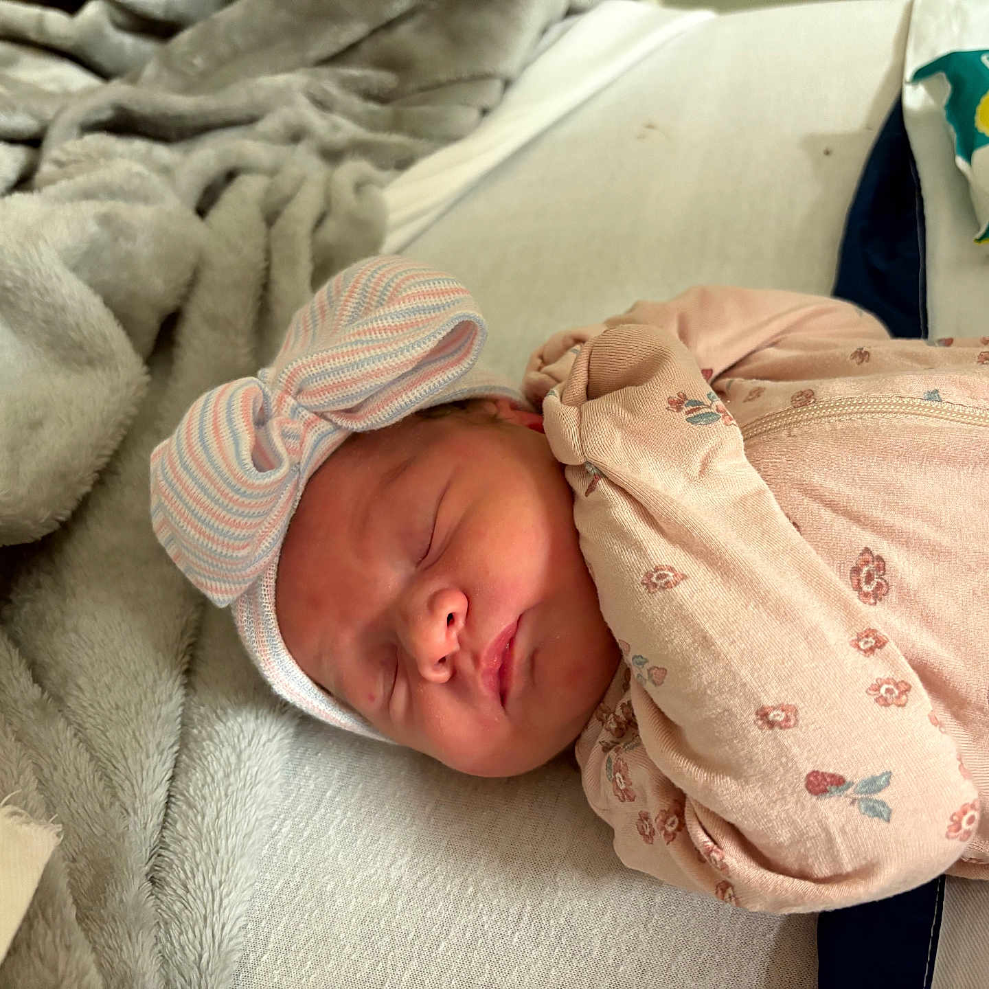 Emmalyn joined the competition — help win amazing prizes! baby, bed, blanket, bow_hat, child, cozy, cute, face, floral_sleeper, headwear, indoors, infant, newborn, pampers, peaceful, person, resting, sleeping, soft, wipes