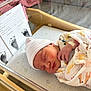 Emmalyn is registered to the contest to win money with this photo: newborn, baby, sleeping, hospital_bassinet, blanket, baby_hat, footprints, family_history, infant, swaddled, medical_band, bed, soft_fabric, peaceful, tiny_hands, portrait, cute, indoor, resting, healthcare