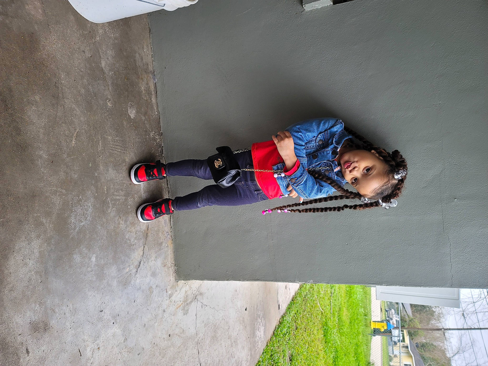 Nevaeh is registered to the contest to win money with this photo: asphalt, carmine, child, concrete, denim, flooring, fun, grey, leisure, pattern, person, plant, recreation, road_surface, shadow, sidewalk, street_fashion, tints_and_shades, toddler, walking_shoe