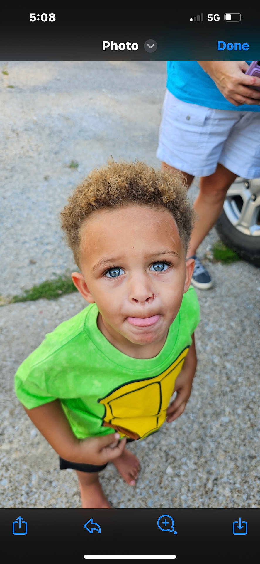 Xzavier joined the competition — help win amazing prizes! child, boy, curly_hair, blue_eyes, green_shirt, barefoot, outdoor, gravel, person, casual_clothing, summer, portrait, standing, cute, expression, young, skin, hand, foot, background