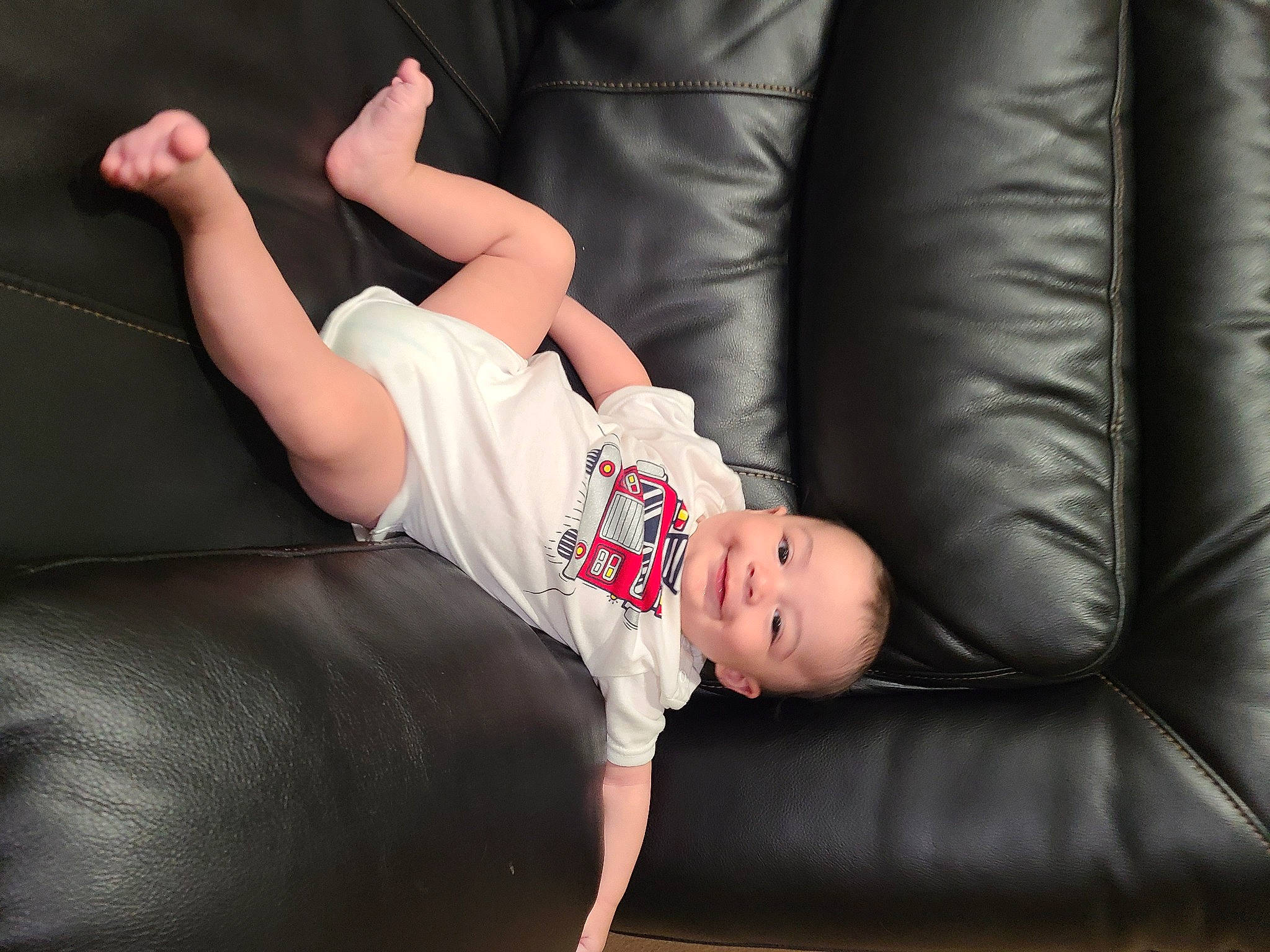 Maximus joined the competition — help win amazing prizes! baby, barefoot, comfort, couch, elbow, eye, face, finger, flash_photography, flooring, foot, head, human_body, human_leg, joy, knee, leg, person, sock, thigh
