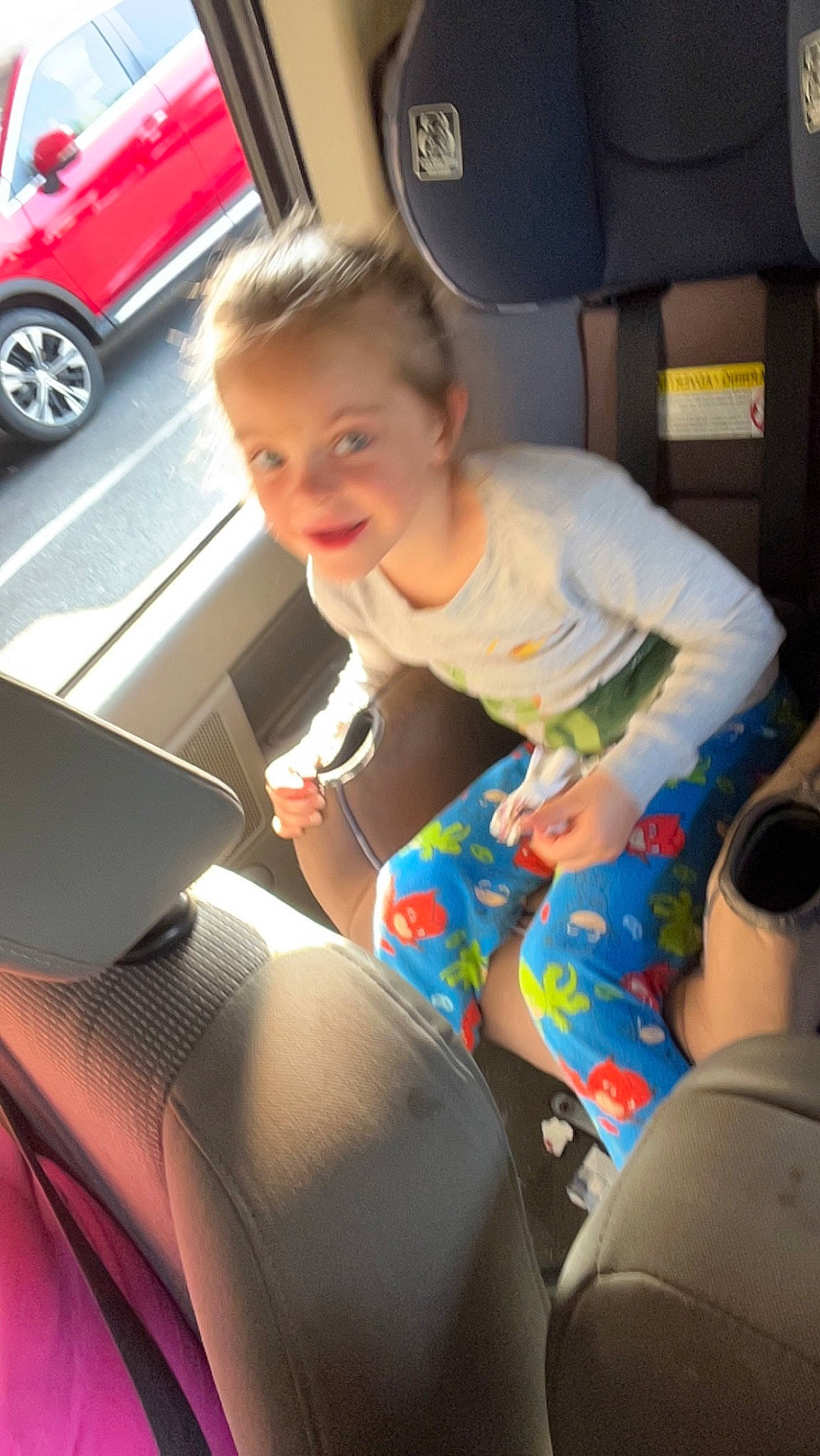 Paityn is registered to the contest to win money with this photo: auto_part, automotive_design, automotive_exterior, car, car_seat, car_seat_cover, fun, joint, joy, knee, lap, laptop, leg, motor_vehicle, person, steering_wheel, thigh, tire, toddler, vehicle