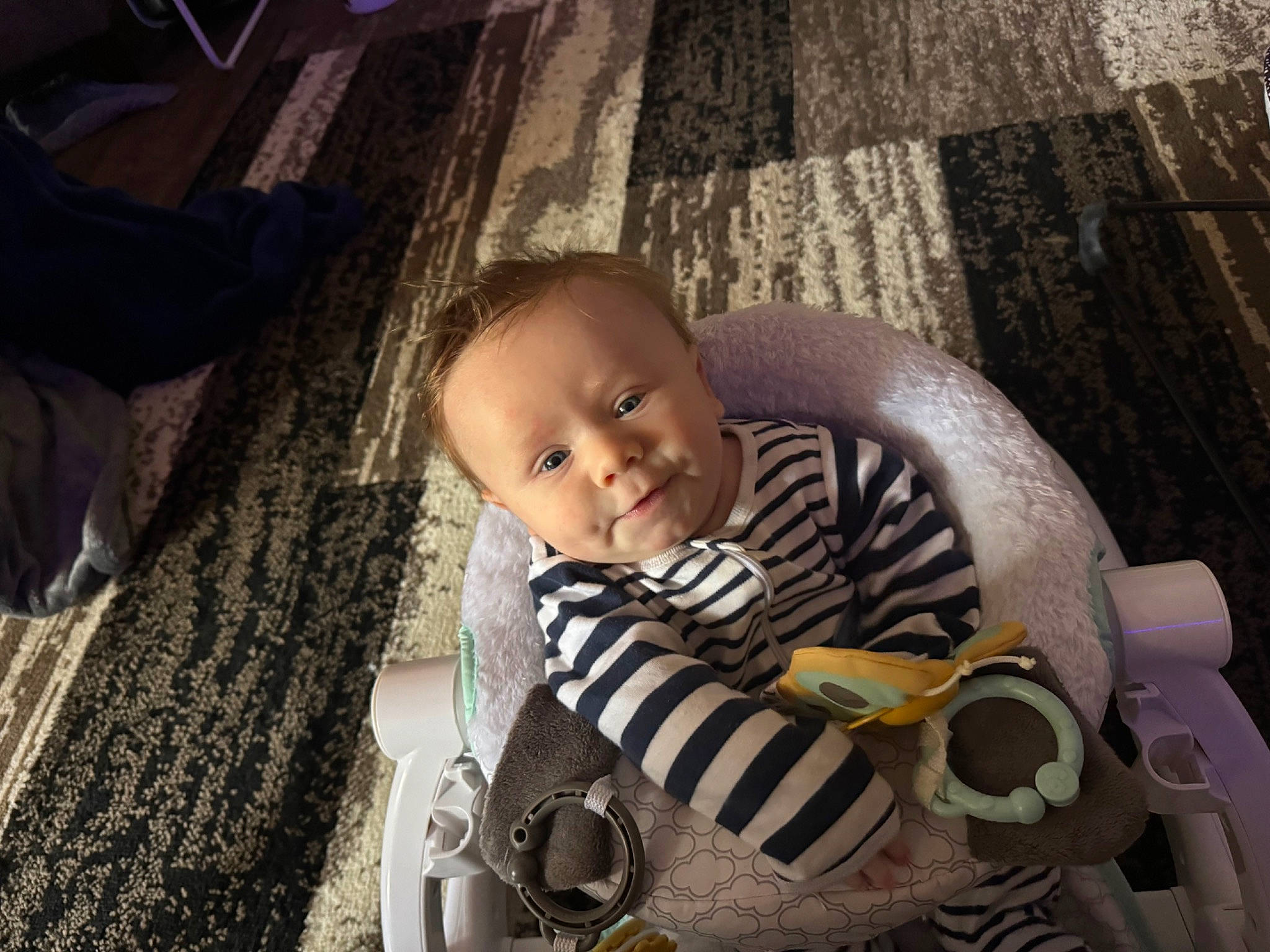 Carter is registered to the contest to win money with this photo: baby, baby_carriage, baby_products, baby_toddler_clothing, cheek, child, comfort, flash_photography, flooring, fun, grass, happy, person, personal_protective_equipment, portrait_photography, sitting, skin, smile, toddler, tree