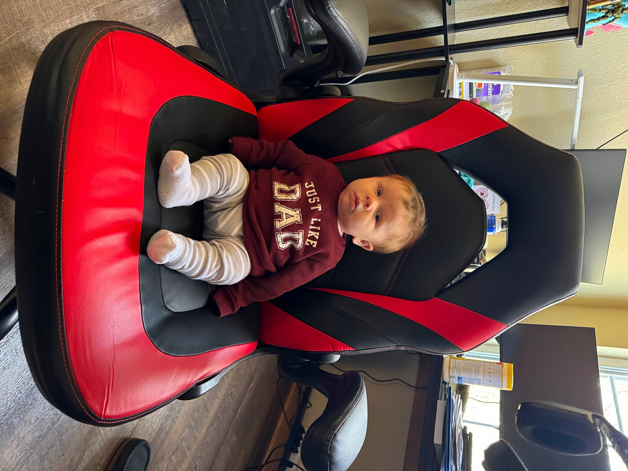 Carter is registered to the contest to win money with this photo: auto_part, automotive_design, automotive_tire, automotive_wheel_system, car_seat, carmine, comfort, family_car, hat, luxury_vehicle, motor_vehicle, person, room, suit, tire, toddler, wheel