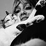 Jupiter joined the competition — help win amazing prizes! animal, black_and_white, cat, close_up, cozy, date_display, eyes, face, fur, indoor, lock_screen, nose_ring, person, pet, phone_screen, portrait, relaxed, snuggling, time_display, weather_info