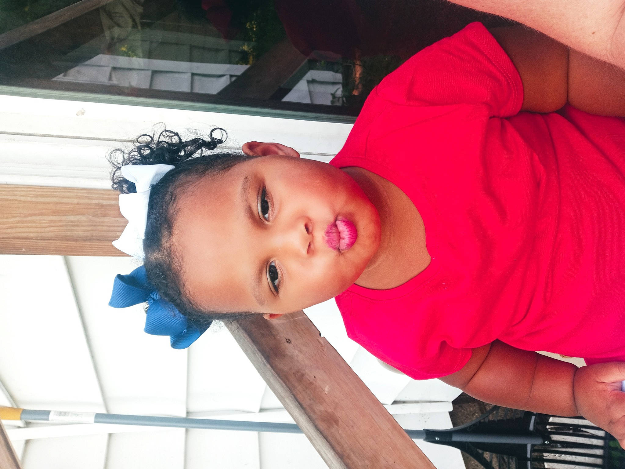 Aaliyah is registered to the contest to win money with this photo: chest, child, elbow, electric_blue, eyelash, fun, hat, joint, magenta, mouth, person, room, sleeve, smile, t_shirt, vacation, wood, wrist