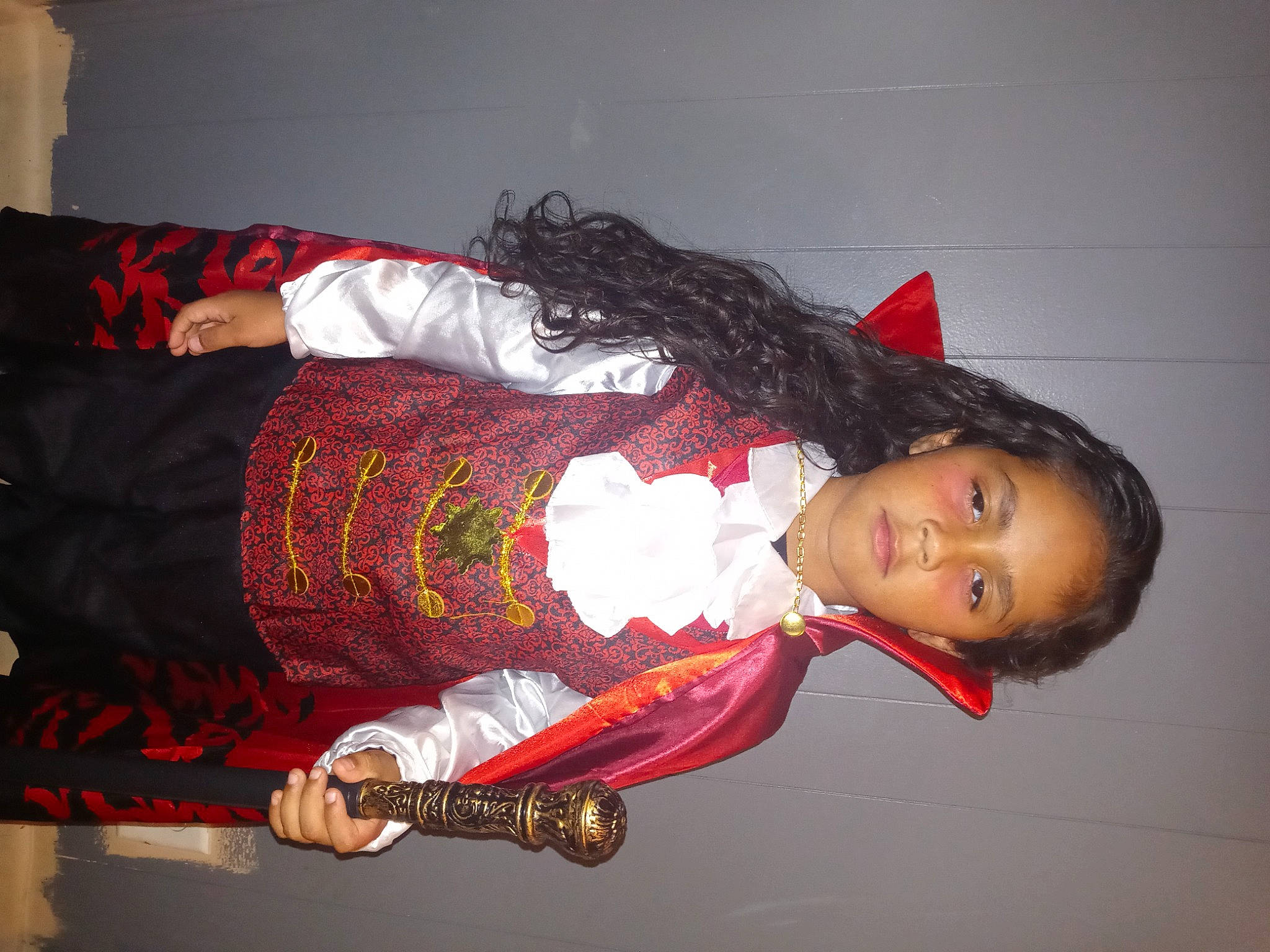 Hezekiah is registered to the contest to win money with this photo: carmine, comfort, costume, elbow, embellishment, lipstick, pattern, person, room, rose, sleeve, thigh, trunk, wrist