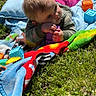 baby, child, grass, blanket, toy, blocks, outdoor, sunlight, colorful, playing, infant, clothing, nature, happy, daylight, crawling, person, cute, toddler, greenery