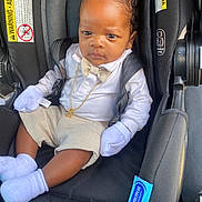 Righteous joined the competition — help win amazing prizes! baby, child, car_seat, infant, clothing, mittens, socks, bow_tie, shorts, white_shirt, black_car_seat, gold_chain, seat_belt, infant_accessory, protective_gear, snugride_lite, cute, portrait, indoors, serious_expression