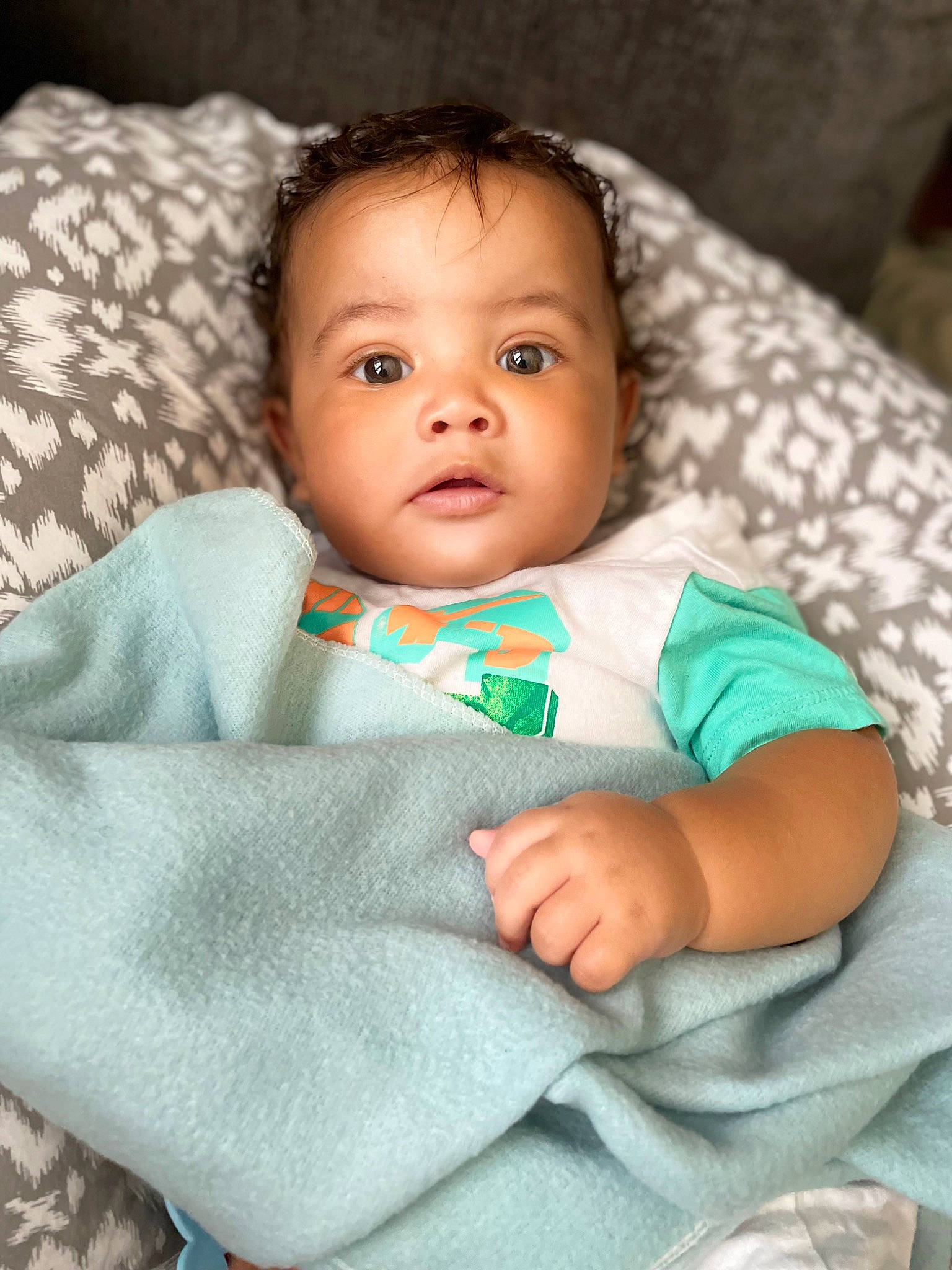 Brayson joined the competition — help win amazing prizes! baby, baby_toddler_clothing, cheek, child, comfort, eye, face, flash_photography, happy, head, human_body, iris, linens, lip, nose, person, sitting, skin, sleeve, textile