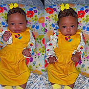 Ahnarrie joined the competition — help win amazing prizes! baby, child, yellow_dress, bow, cute, portrait, infant, floral_pillow, smile, tongue_out, expression, sitting, colorful, indoors, clothing, face, hands, young_child, patterned_background, cozy