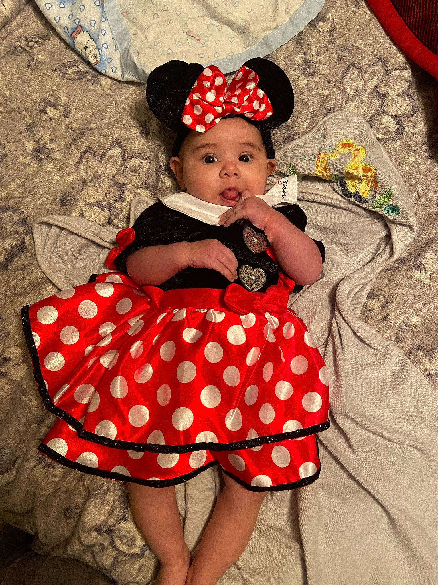 Skylar joined the competition — help win amazing prizes! baby, baby_toddler_clothing, child, costume_hat, day_dress, dress, fun, happy, hat, headwear, magenta, one_piece_garment, pattern, person, pink, red, sitting, skin, sleeve, sun_hat