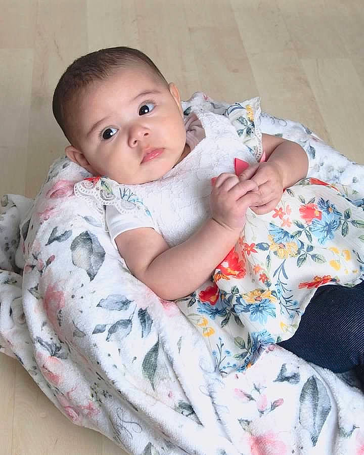 Skylar is registered to the contest to win money with this photo: baby, baby_products, baby_toddler_clothing, bedding, cheek, child, comfort, eye, happy, iris, linens, lip, pattern, person, product, sitting, skin, sleeve, t_shirt, textile