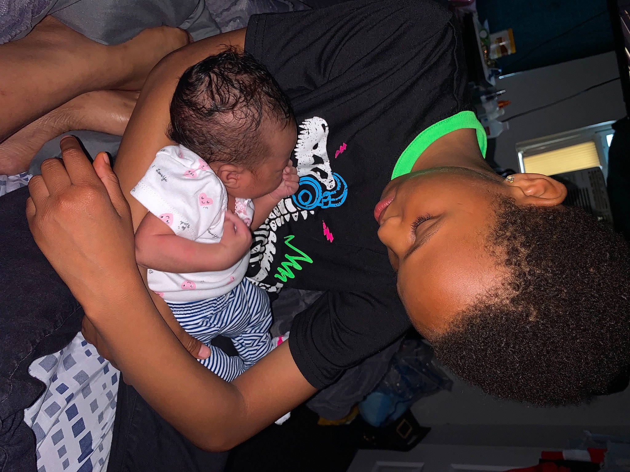 Michael is registered to the contest to win money with this photo: adaptation, baby, child, elbow, event, eyewear, flash_photography, fun, hairstyle, happy, human, interaction, mammal, mouth, party, pattern, person, room, t_shirt, thigh