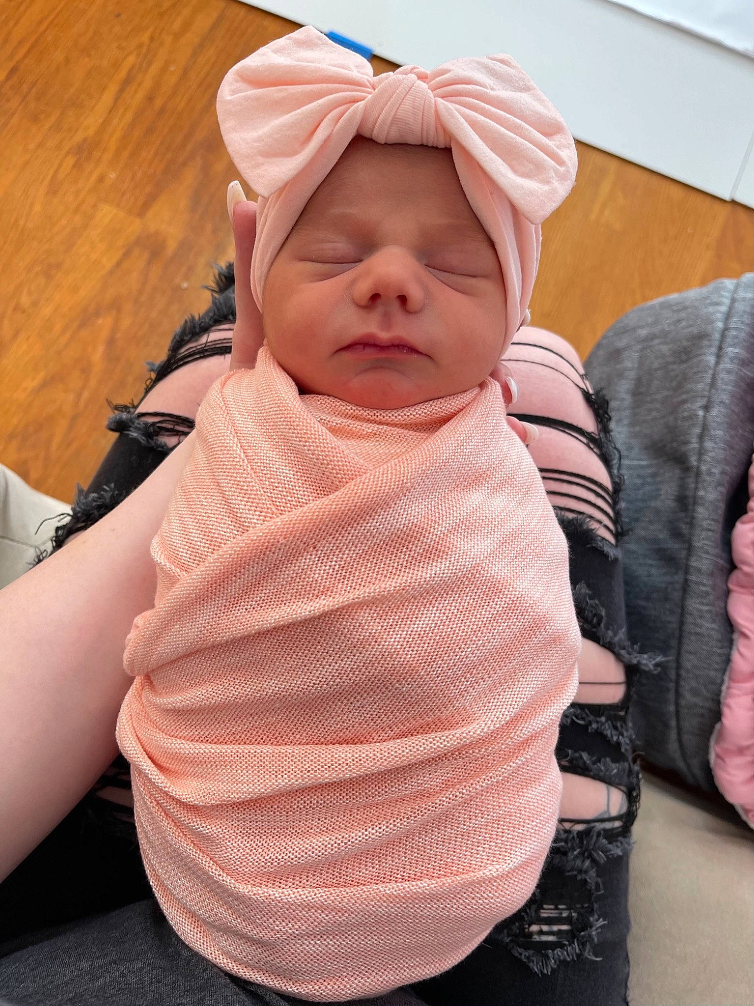 Charlotte is registered to the contest to win money with this photo: baby, baby_products, baby_toddler_clothing, cheek, chin, comfort, face, facial_expression, finger, gesture, head, headgear, headwear, linens, mouth, person, pink, skin, sleeve, textile