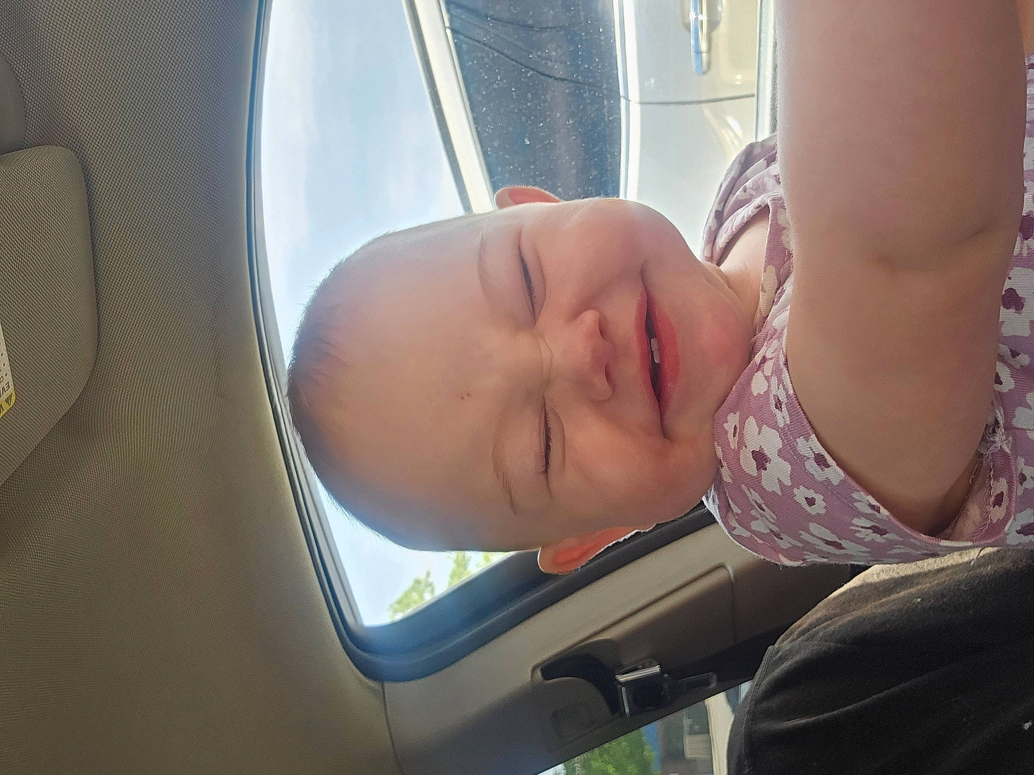 Susan is registered to the contest to win money with this photo: air_travel, auto_part, automotive_design, automotive_exterior, automotive_lighting, automotive_window_part, baby, car_seat, child, comfort, family_car, fun, head_restraint, motor_vehicle, mouth, person, smile, toddler, vehicle_door, window