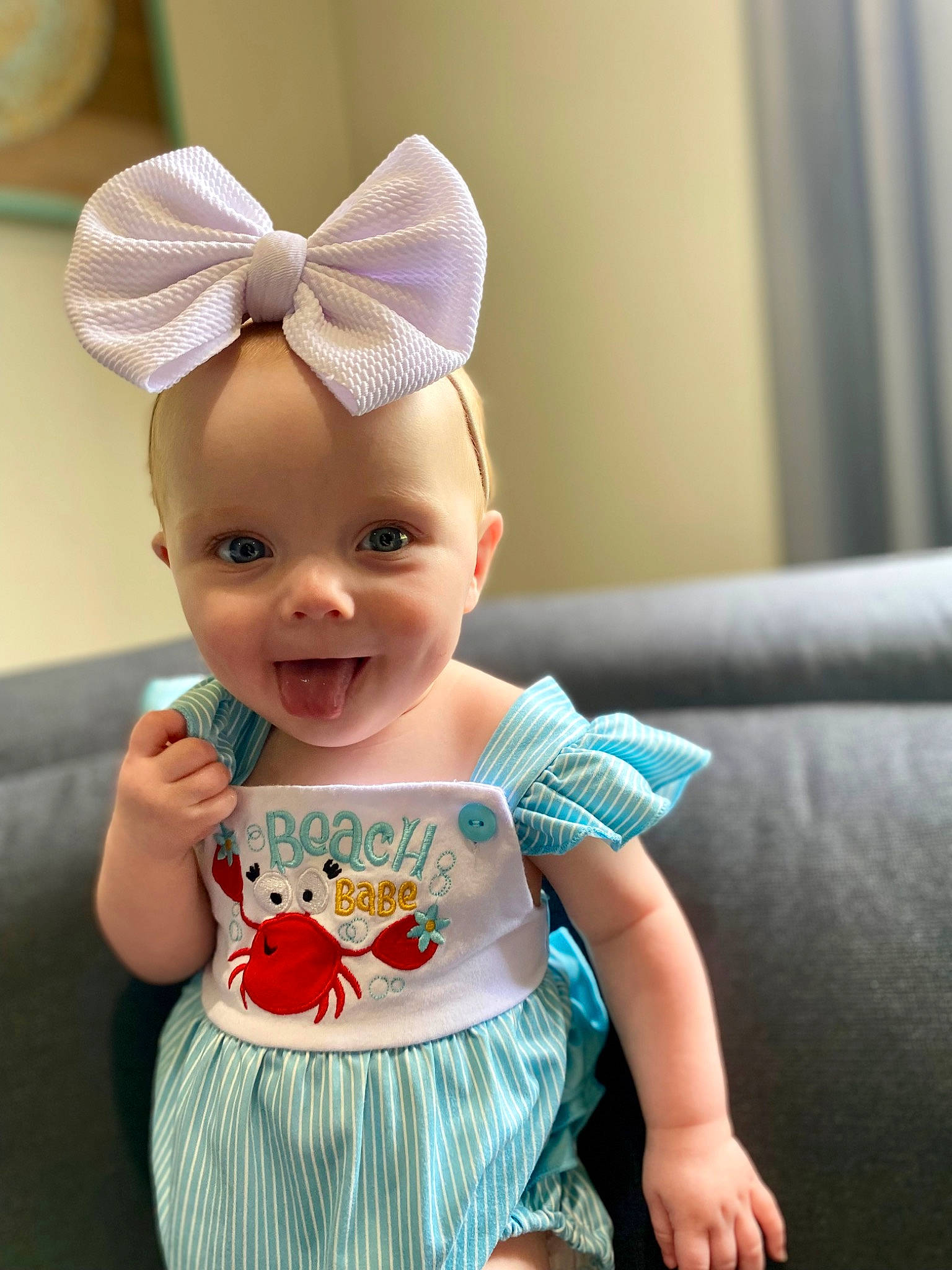 Charli is registered to the contest to win money with this photo: arm, baby_toddler_clothing, cap, costume_hat, ear, eye, face, facial_expression, fashion, happy, head, joy, mammal, organ, person, pink, product, skin, sleeve, smile