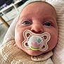 Lou participe au concours pour gagner de l'argent avec cette photo : baby, infant, pacifier, face, blue_eyes, clothing, blanket, closeup, cute, indoors, child, portrait, soft_lighting, baby_bib, newborn, sleepy, young_child, head, skin, expression