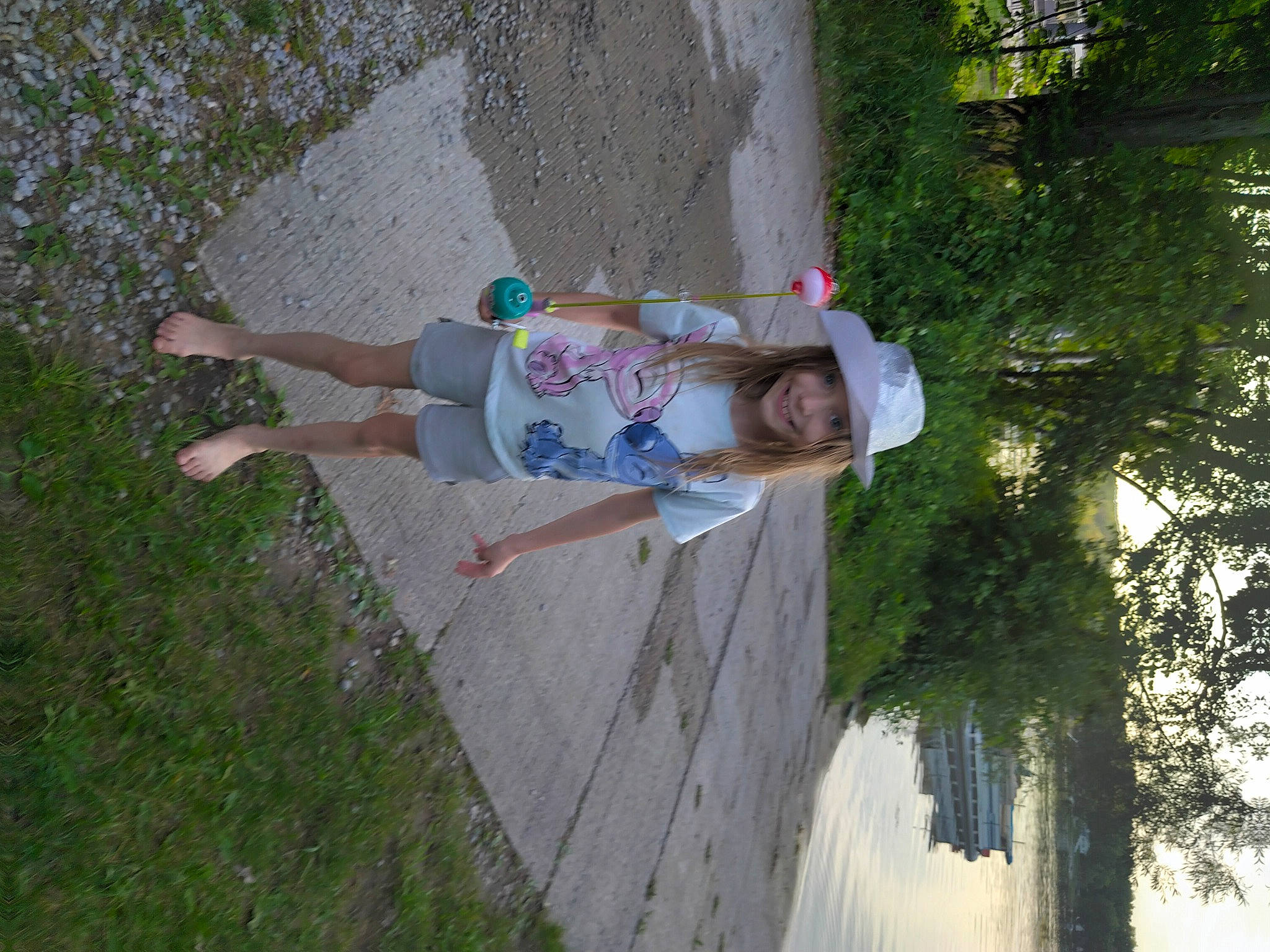 Mary Jane is registered to the contest to win money with this photo: concrete, fun, grass, groundcover, headwear, joy, leisure, people_in_nature, person, plant, sidewalk, thigh, tree, walking_shoe, wood