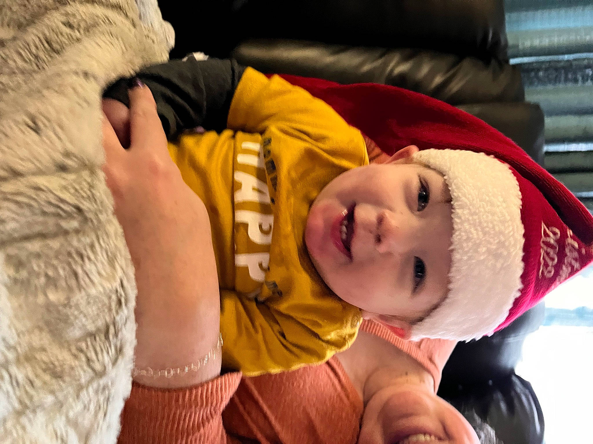 Nathaniel is registered to the contest to win money with this photo: baby, cap, child, comfort, couch, felidae, fun, fur, gesture, hand, happy, headgear, headwear, linens, mouth, nose, person, skin, smile, toddler