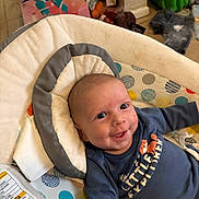 Colten joined the competition — help win amazing prizes! baby, infant, smiling, blue_shirt, baby_seat, polka_dots, cushion, indoor, child, face, happy, clothing, head, person, seat_belt, room, toy, floor, colorful, expression