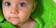 Alessio participe au concours pour gagner de l'argent avec cette photo : baby, child, hood, green, towel, blue_eyes, face, portrait, cute, expression, skin, eyelashes, indoor, clothing, person, young, infant, closeup, soft, adorable