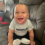 Ashton is registered to the contest to win money with this photo: baby, babylaughing, clothing, face, happy, head, hosiery, laughing, person, photography, portrait, sitting, sock