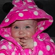 Arabella joined the competition — help win amazing prizes! baby, child, hoodie, pink, polka_dot, cute, face, hand, fingers, blue_eyes, soft, warm_clothing, indoor, portrait, infant, smiling, cozy, couch, expression, hood
