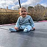 Esmée a rejoint le concours — aidez-le/la à gagner de superbes lots ! baby, blue, child, clouds, cute, daytime, fun, happy, house, infant, nature, outdoor, pajamas, play, sitting, sky, smiling, sunny, trampoline, trees