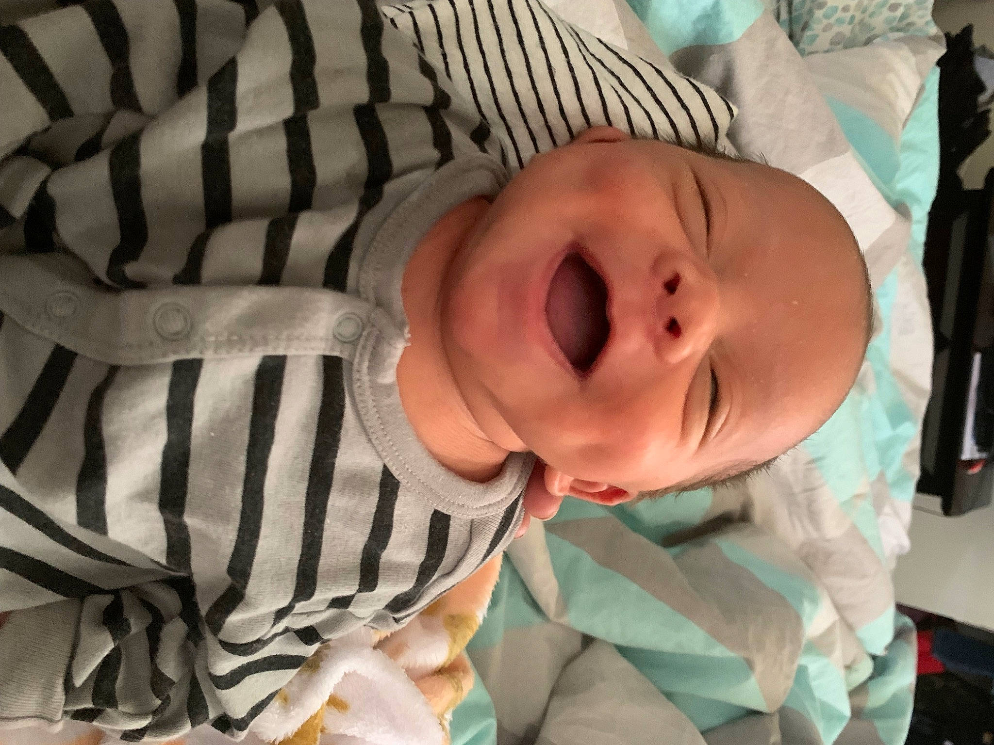 Damien is registered to the contest to win money with this photo: baby, baby_products, baby_safety, baby_toddler_clothing, cheek, child, comfort, human_body, linens, mammal, pattern, person, room, sleep, sleeve, toddler