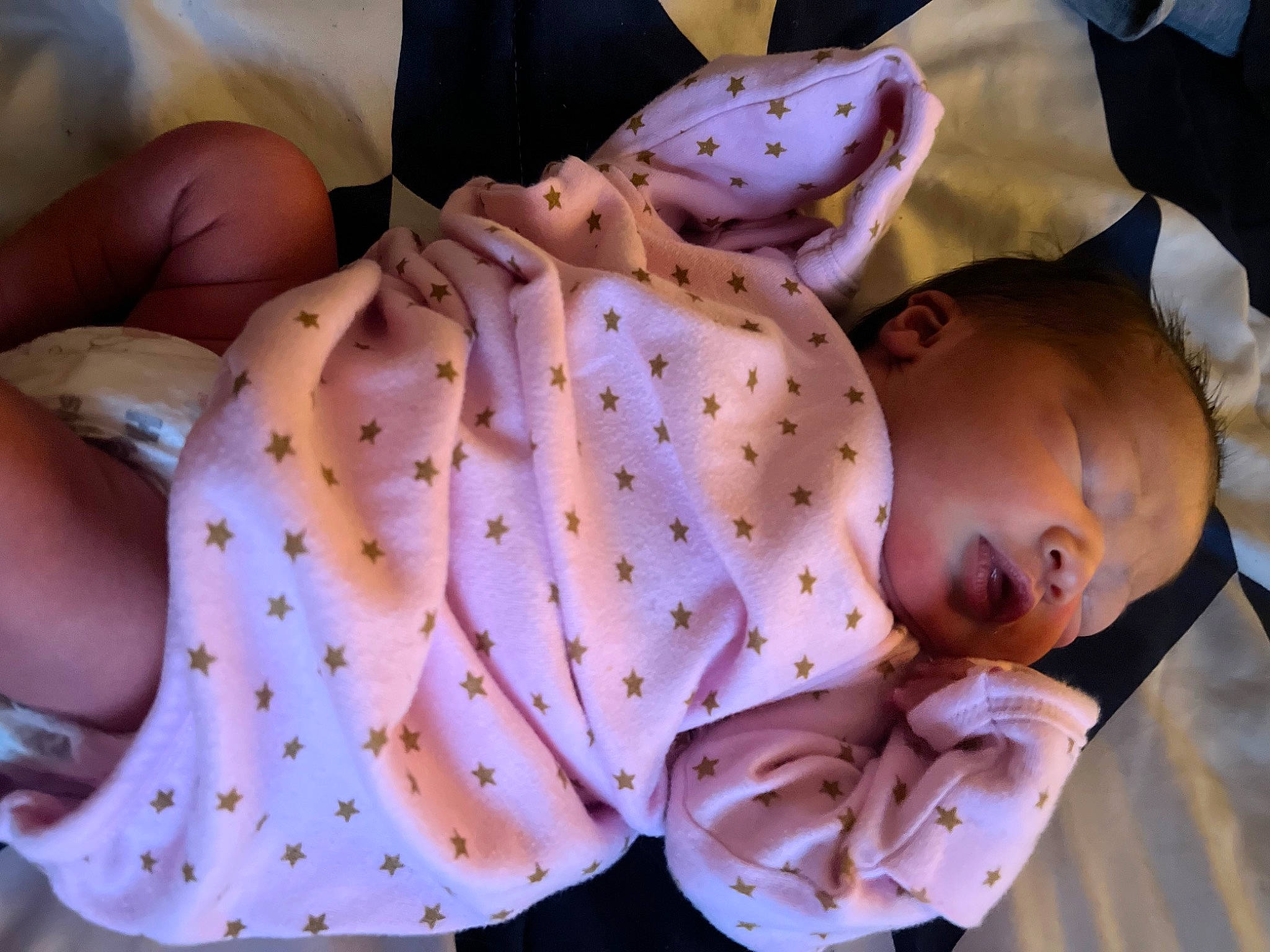 Aurora is registered to the contest to win money with this photo: abdomen, baby, baby_products, baby_safety, baby_toddler_clothing, cheek, child, comfort, facial_expression, mammal, mouth, nail, pattern, person, product, sitting, skin, sleep, sleeve, toddler