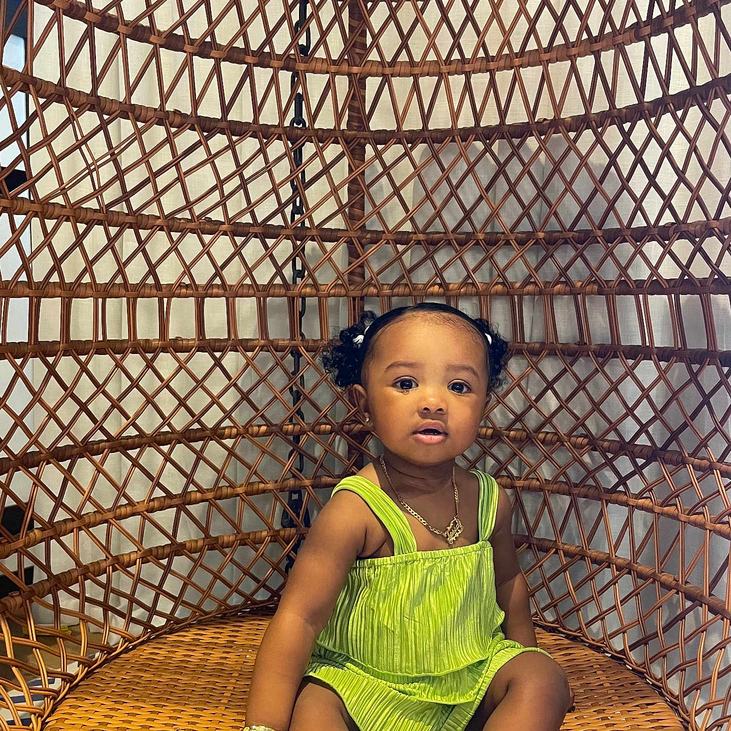 Tessa is registered to the contest to win money with this photo: accessories, basket, child, clothing, face, female, footwear, furniture, girl, happy, head, jewelry, necklace, outdoors, person, photography, playarea, portrait, sitting, smile