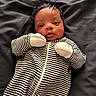 Sire joined the competition — help win amazing prizes! baby, infant, striped_clothing, onesie, mittens, drool, lying_down, blanket, soft_texture, cute, face, portrait, newborn, child, sleepwear, black_hair, indoors, resting, adorable, curious