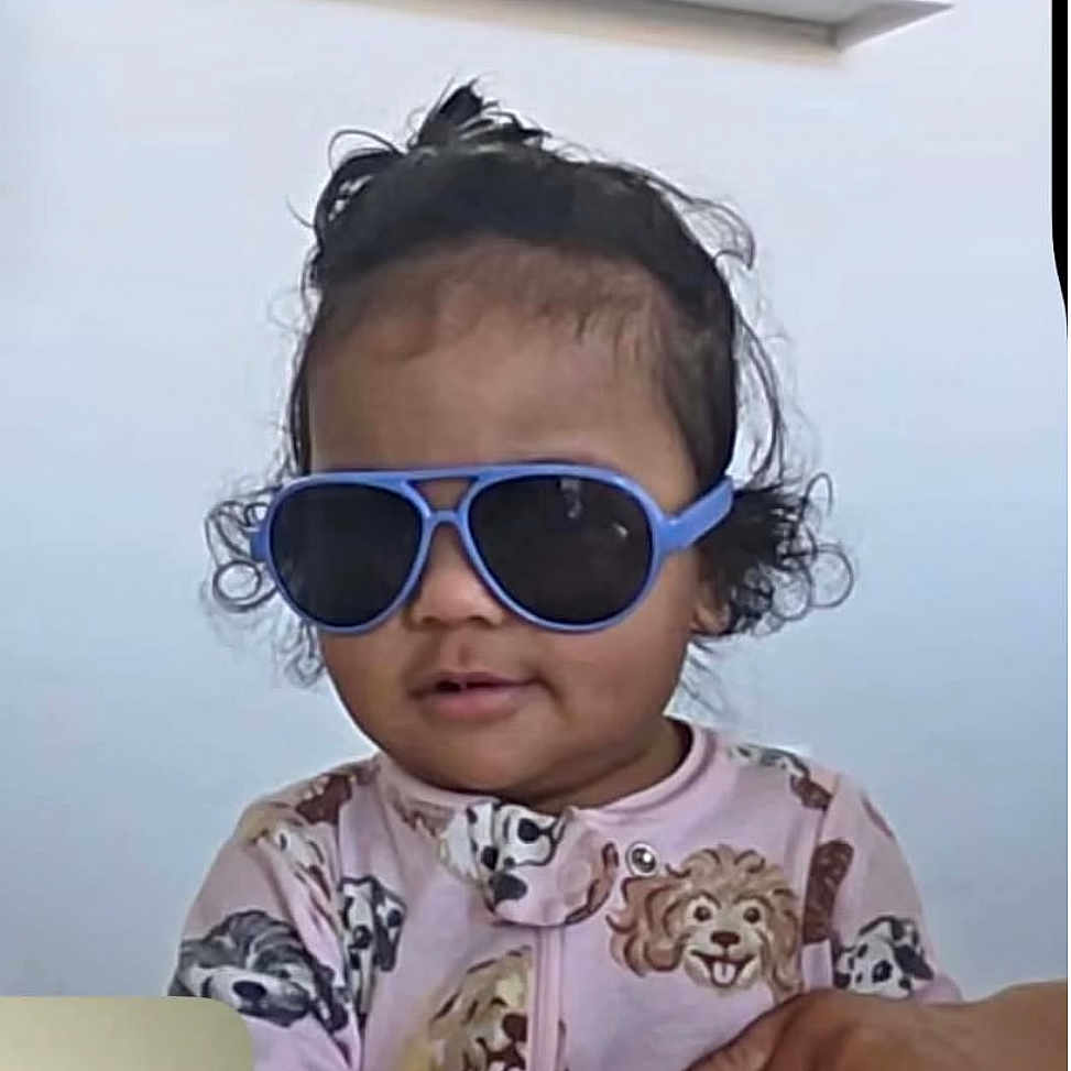 Laili Atwood joined the competition — help win amazing prizes! toddler, child, sunglasses, blue, hair, curly_hair, topknot, clothing, dog_pattern, cute, indoor, portrait, person, baby, face, expression, fashion, casual, young_child, smile