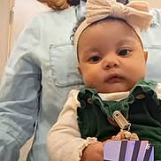 Isabella Swain joined the competition — help win amazing prizes! baby, bow, casual_clothing, child, communication, expression, face, glasses, headband, holding, indoor, inset, interaction, light, person, portrait, room, technology, video_call, woman